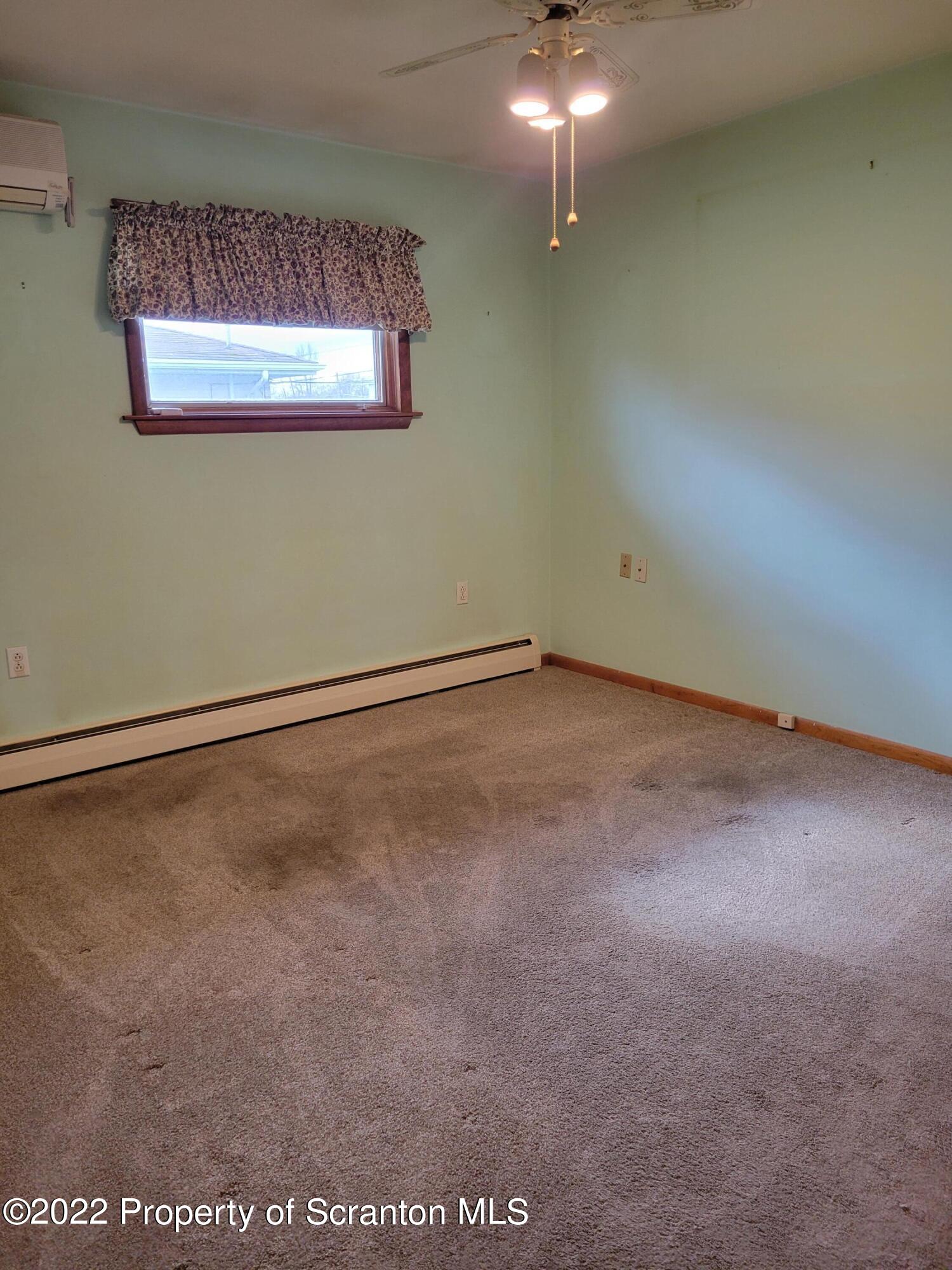 106 Billy Lane Taylor, PA 18517 - Photo 10 of 15 a view of an empty room with a chandelier fan