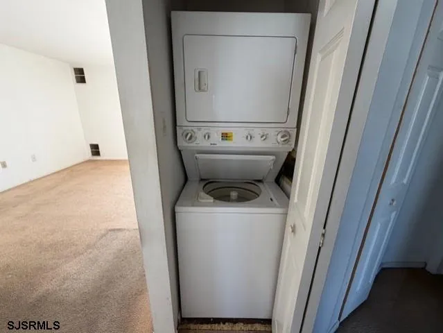an empty room with wooden floor and entrance