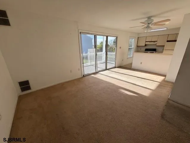 a kitchen with a sink and stainless steel appliances
