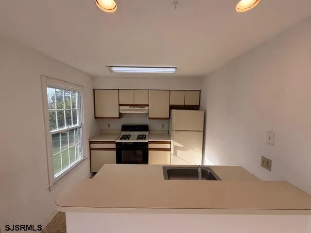 a utility room with washer and dryer
