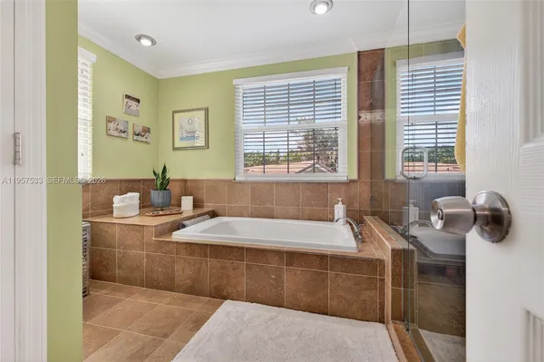 a bathroom with a granite countertop sink toilet a mirror a vanity and shower