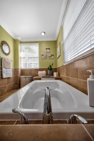 a kitchen with stainless steel appliances granite countertop a stove a sink dishwasher and a refrigerator