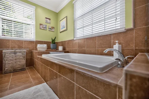 a kitchen with stainless steel appliances granite countertop a refrigerator sink and cabinets