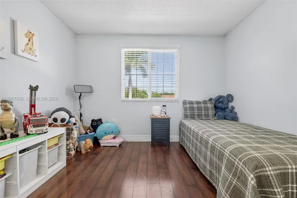 a view of a livingroom with furniture and a window