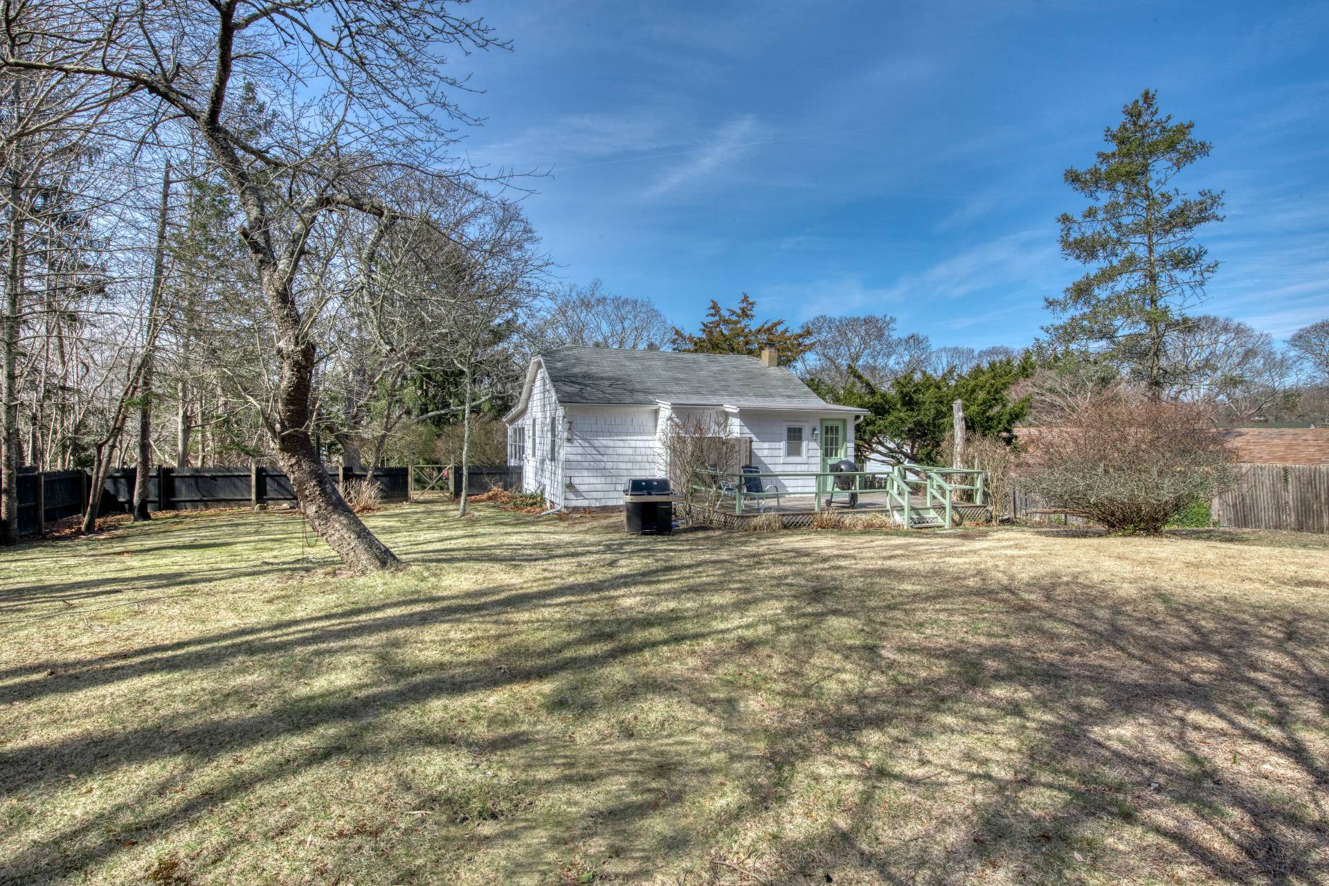205 Little Fresh Pond Road Southampton, NY 11968 - Photo 18 of 20 a view of a house with a yard and a garage