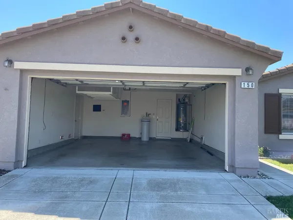 a view of kitchen with sink microwave and refrigerator