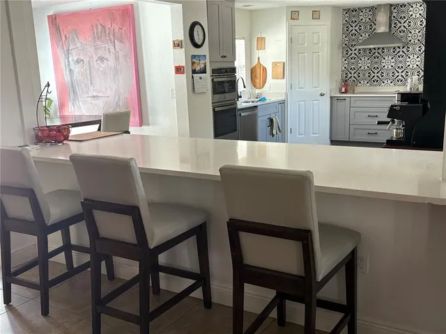 a view of a dining room with furniture and window