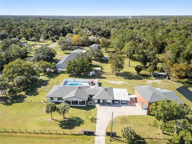 a view of a swimming pool with a yard