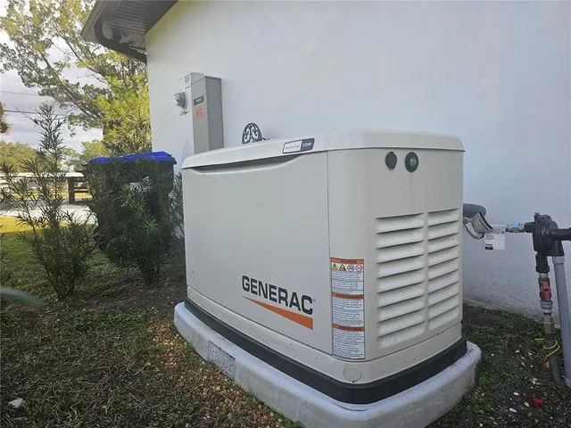 an aerial view of residential houses with outdoor space and swimming pool
