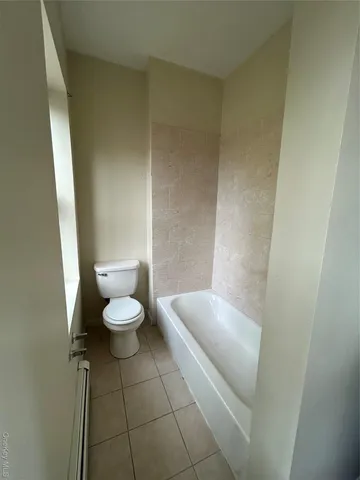 a bathroom with a toilet and a sink