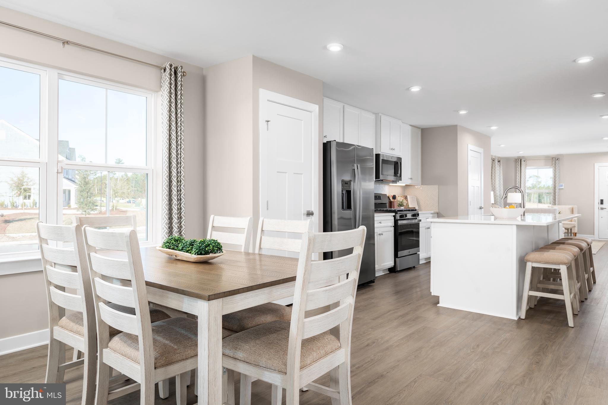 604 Augustine Court Aberdeen, MD 21001 - Photo 2 of 9 a kitchen with white cabinets and refrigerator