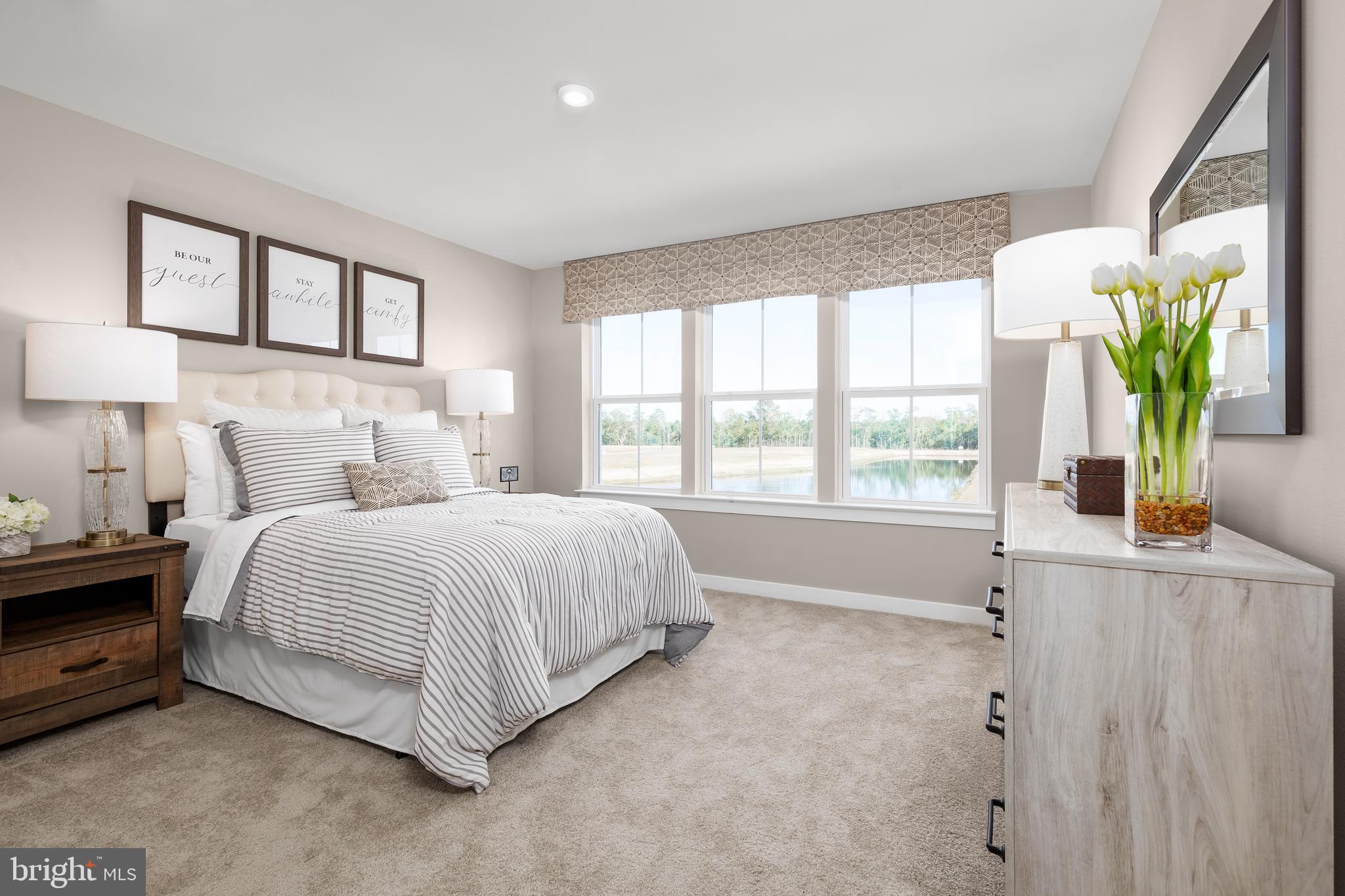 604 Augustine Court Aberdeen, MD 21001 - Photo 4 of 9 a spacious bedroom with a bed and a window