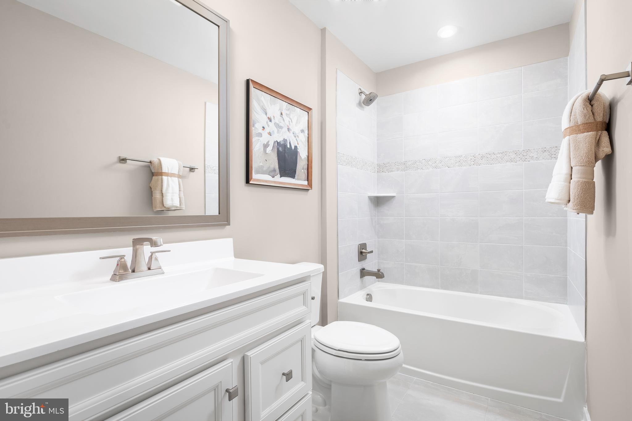 604 Augustine Court Aberdeen, MD 21001 - Photo 6 of 9 a bathroom with a sink a toilet and a bathtub