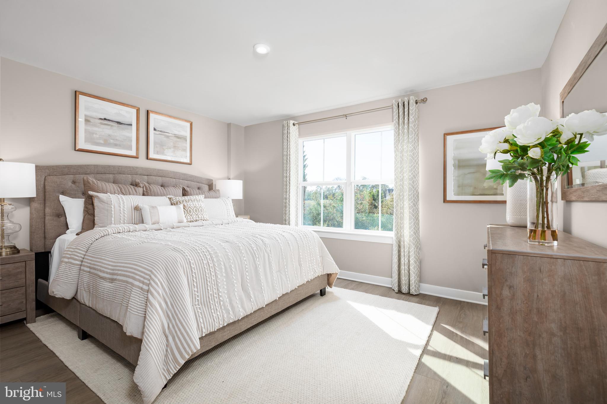 604 Augustine Court Aberdeen, MD 21001 - Photo 7 of 9 a bedroom with a bed table and a window