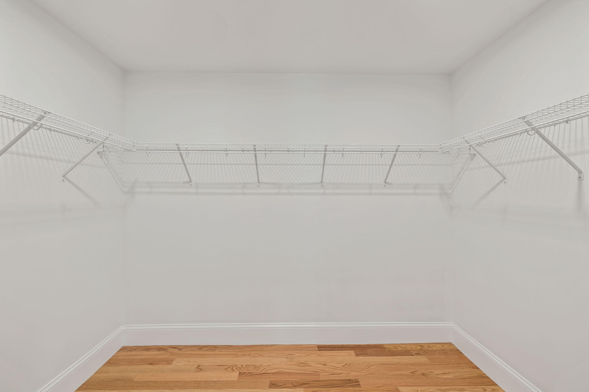 Undisclosed Address Sagamore Beach, MA 02562 - Photo 13 of 43 a view of a room with racks on the wall