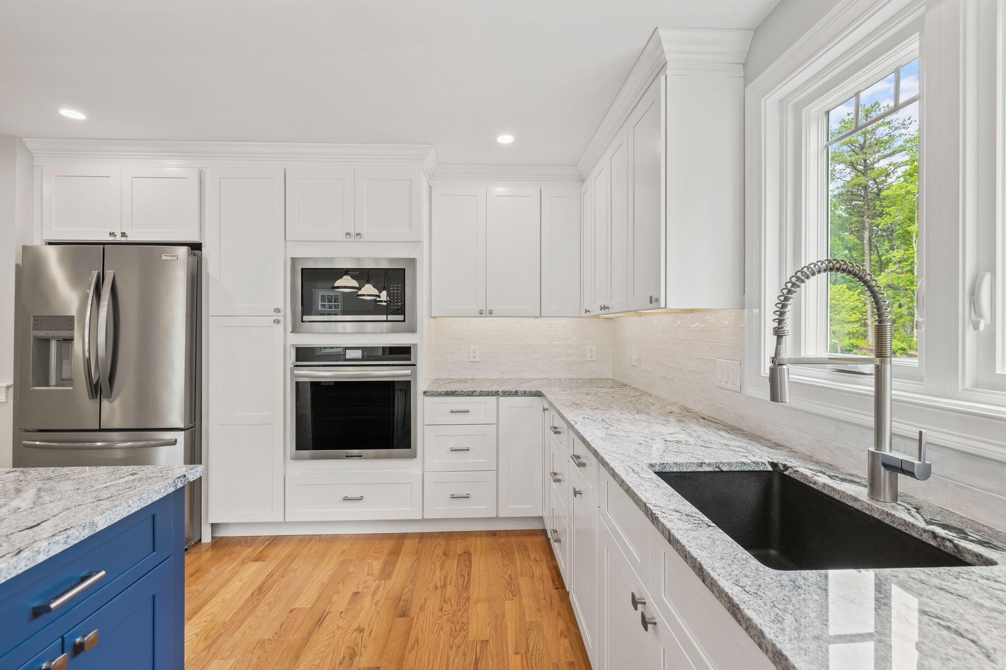 Undisclosed Address Sagamore Beach, MA 02562 - Photo 14 of 43 a kitchen with granite countertop a sink a counter space appliances and cabinets