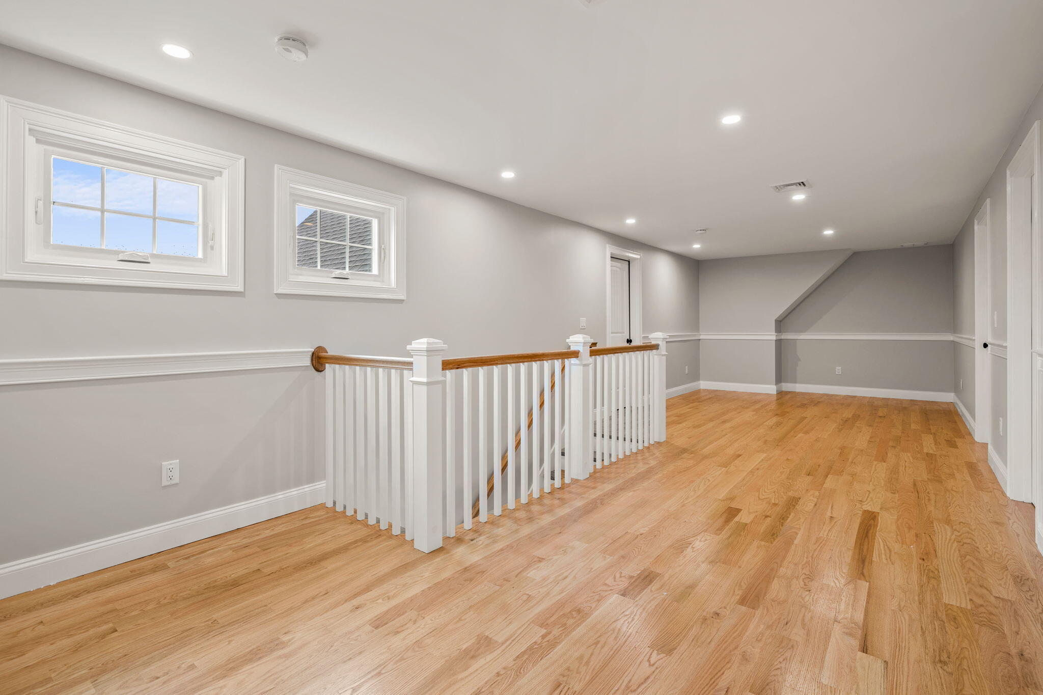 Undisclosed Address Sagamore Beach, MA 02562 - Photo 18 of 43 a view of an empty room with wooden floor and a window