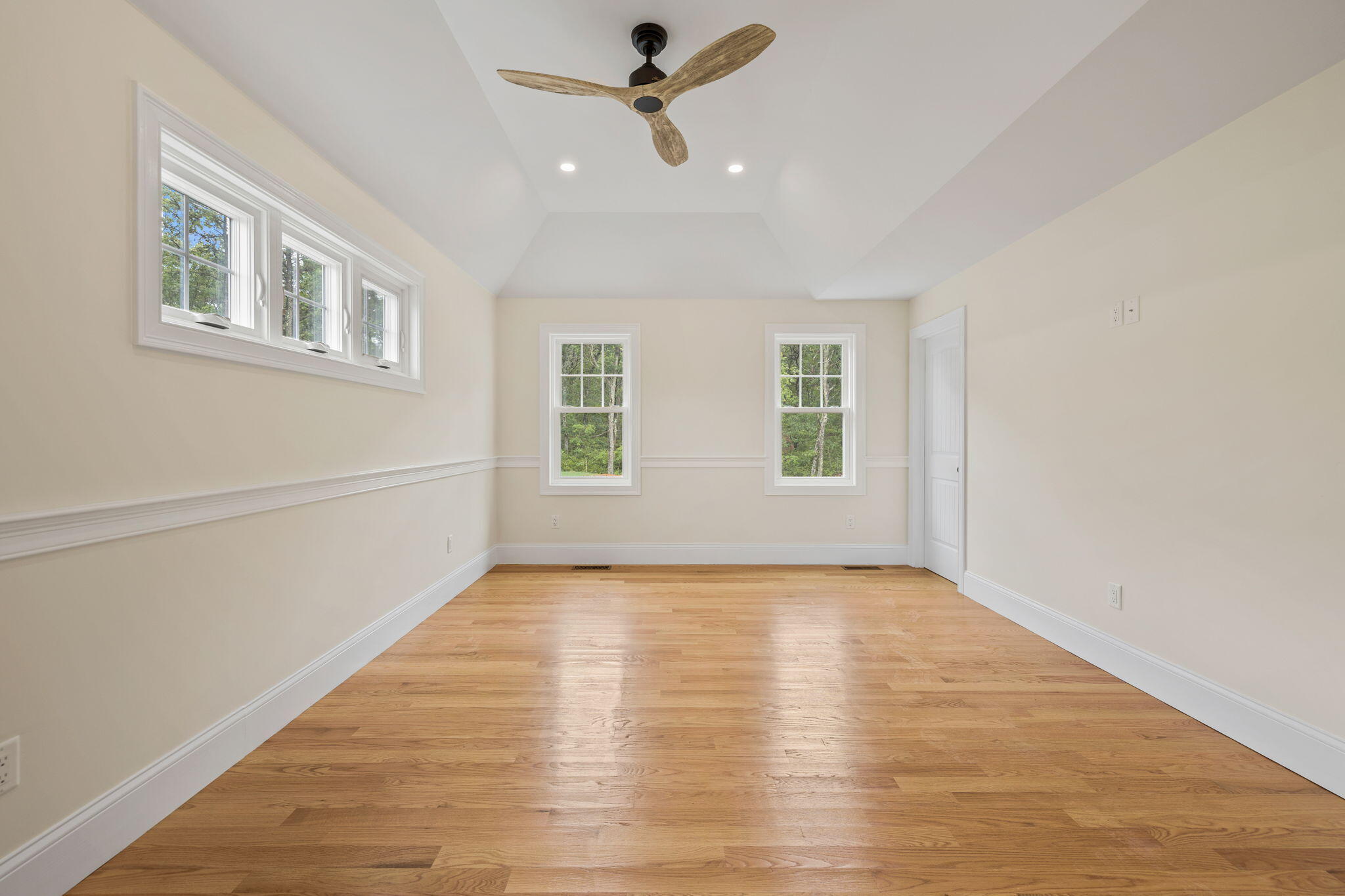 Undisclosed Address Sagamore Beach, MA 02562 - Photo 23 of 43 a view of an empty room with wooden floor and a window