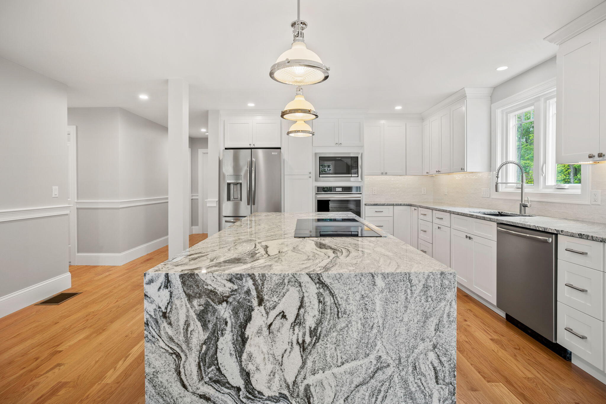 Undisclosed Address Sagamore Beach, MA 02562 - Photo 36 of 43 a kitchen with kitchen island granite countertop a sink stove and refrigerator