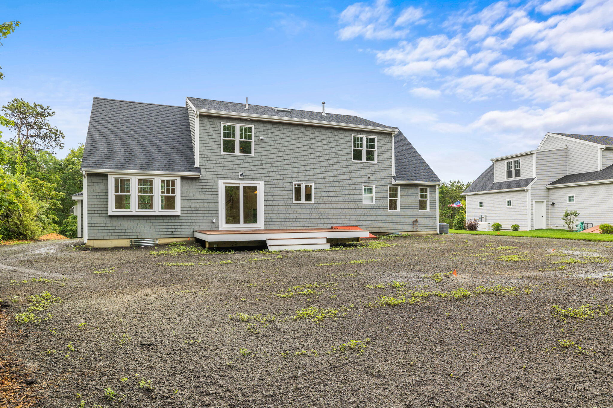 Undisclosed Address Sagamore Beach, MA 02562 - Photo 6 of 43 a view of a house with a yard