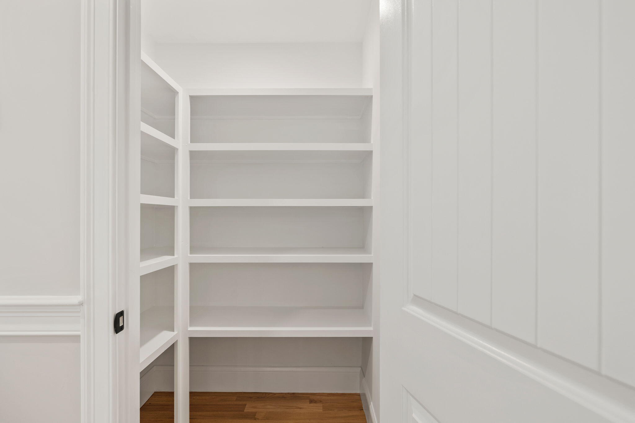 Undisclosed Address Sagamore Beach, MA 02562 - Photo 10 of 43 a view of walk in closet with empty racks
