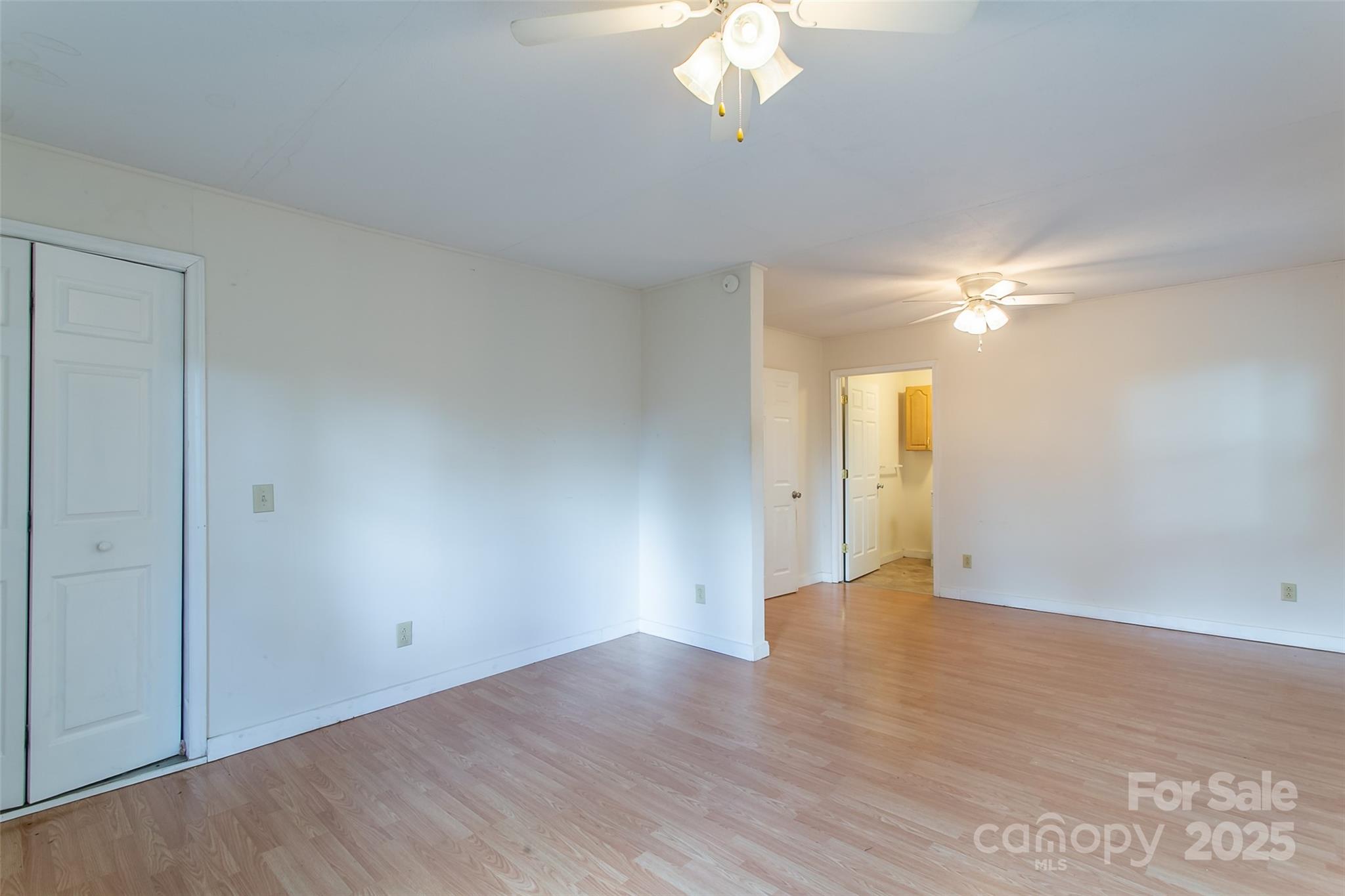 27 Curlee Street Brevard, NC 28712 - Photo 13 of 30 a view of an empty room with wooden floor
