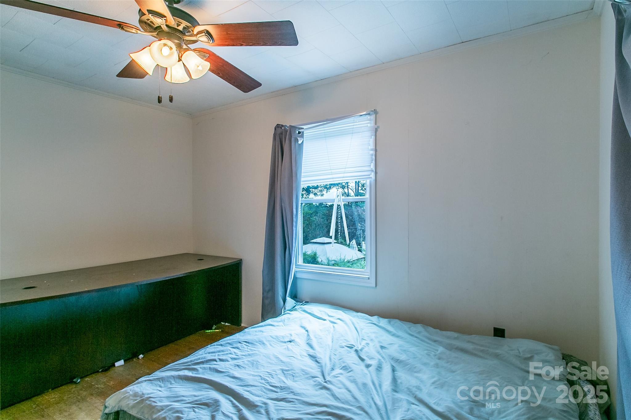 27 Curlee Street Brevard, NC 28712 - Photo 24 of 30 a bedroom with a bed and a window