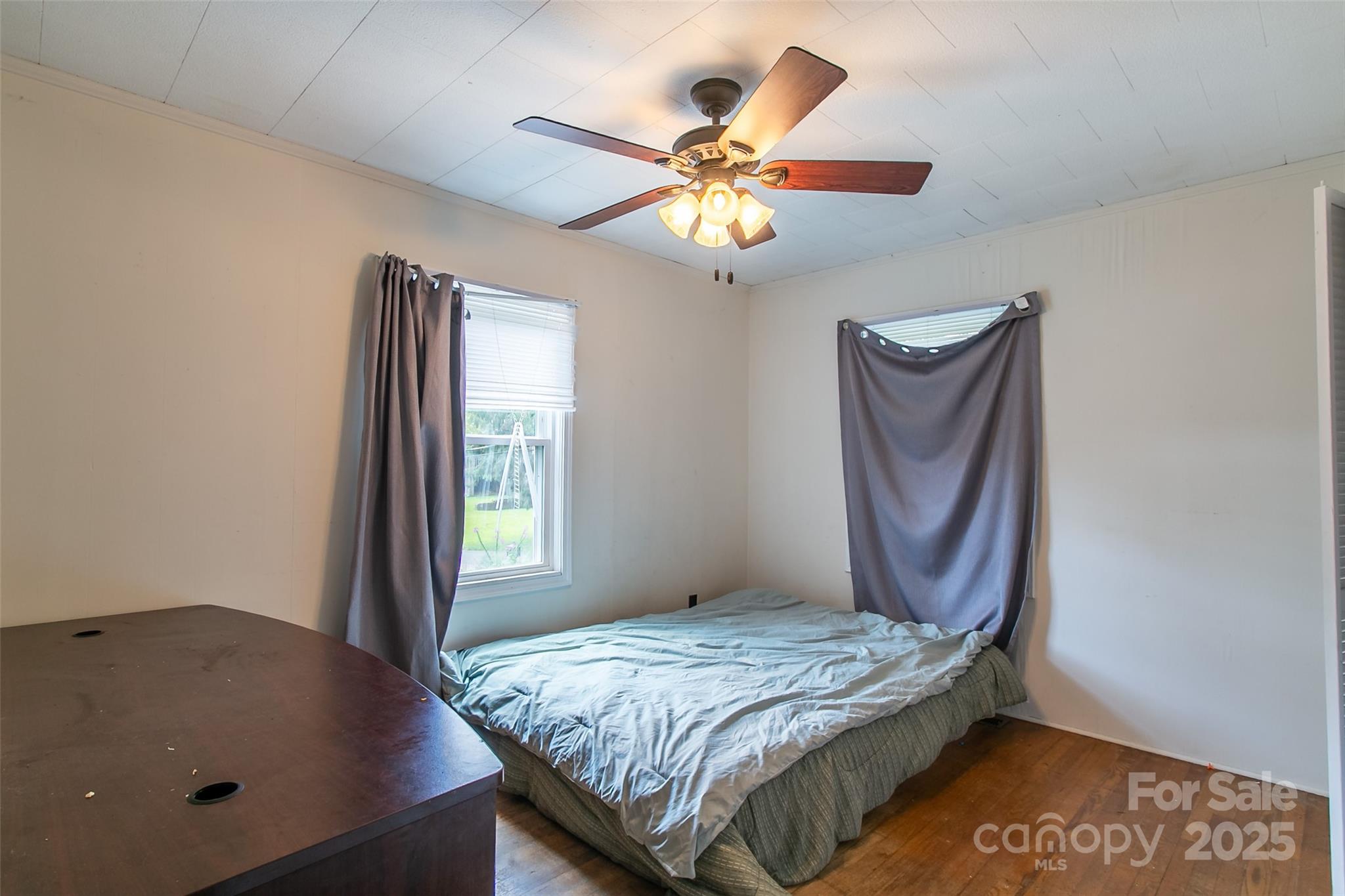 27 Curlee Street Brevard, NC 28712 - Photo 25 of 30 a bedroom with a bed and a window