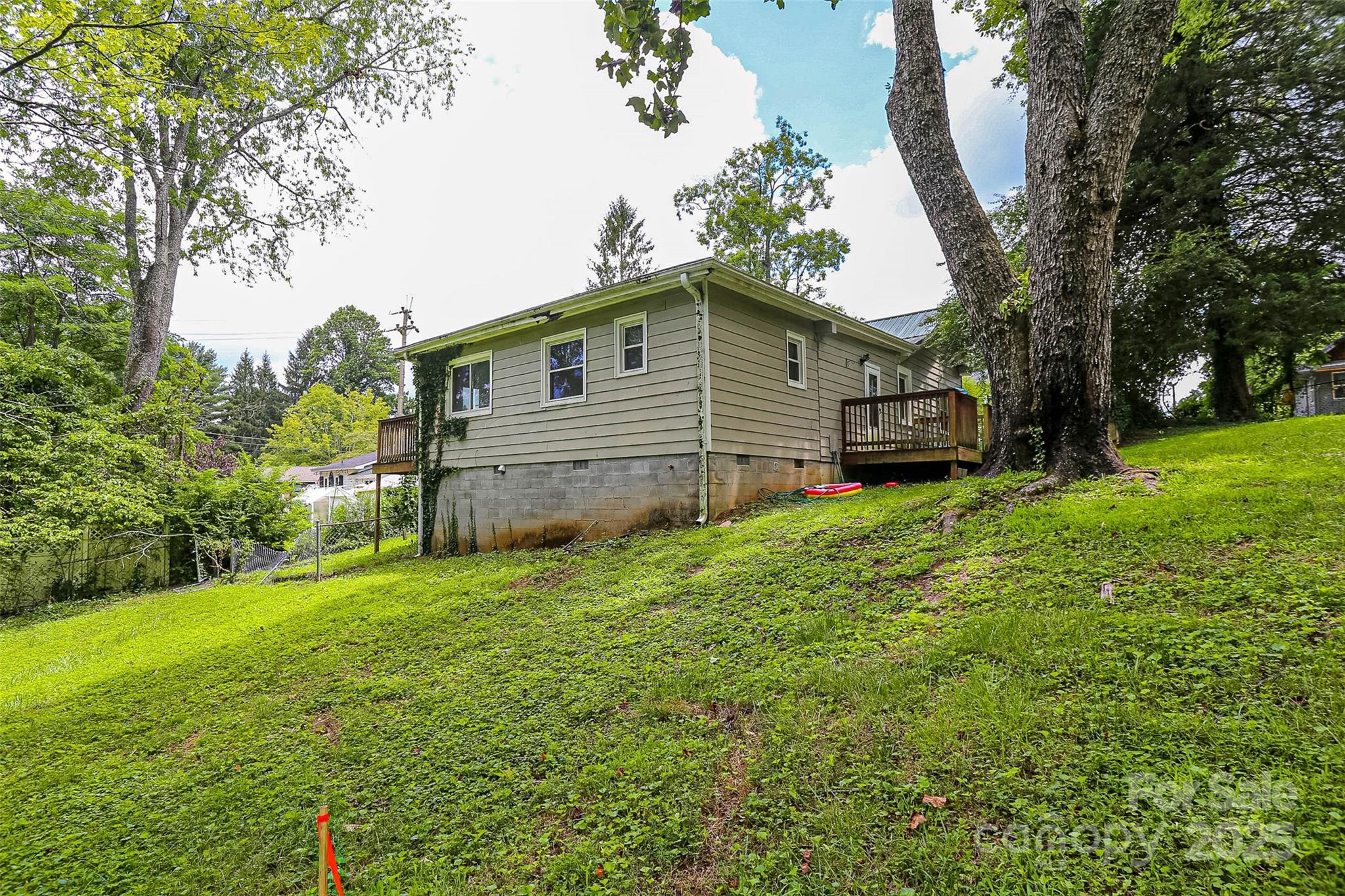 27 Curlee Street Brevard, NC 28712 - Photo 27 of 30 a view of a house with a yard