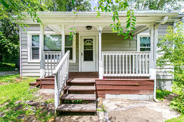 a front view of a house with a porch