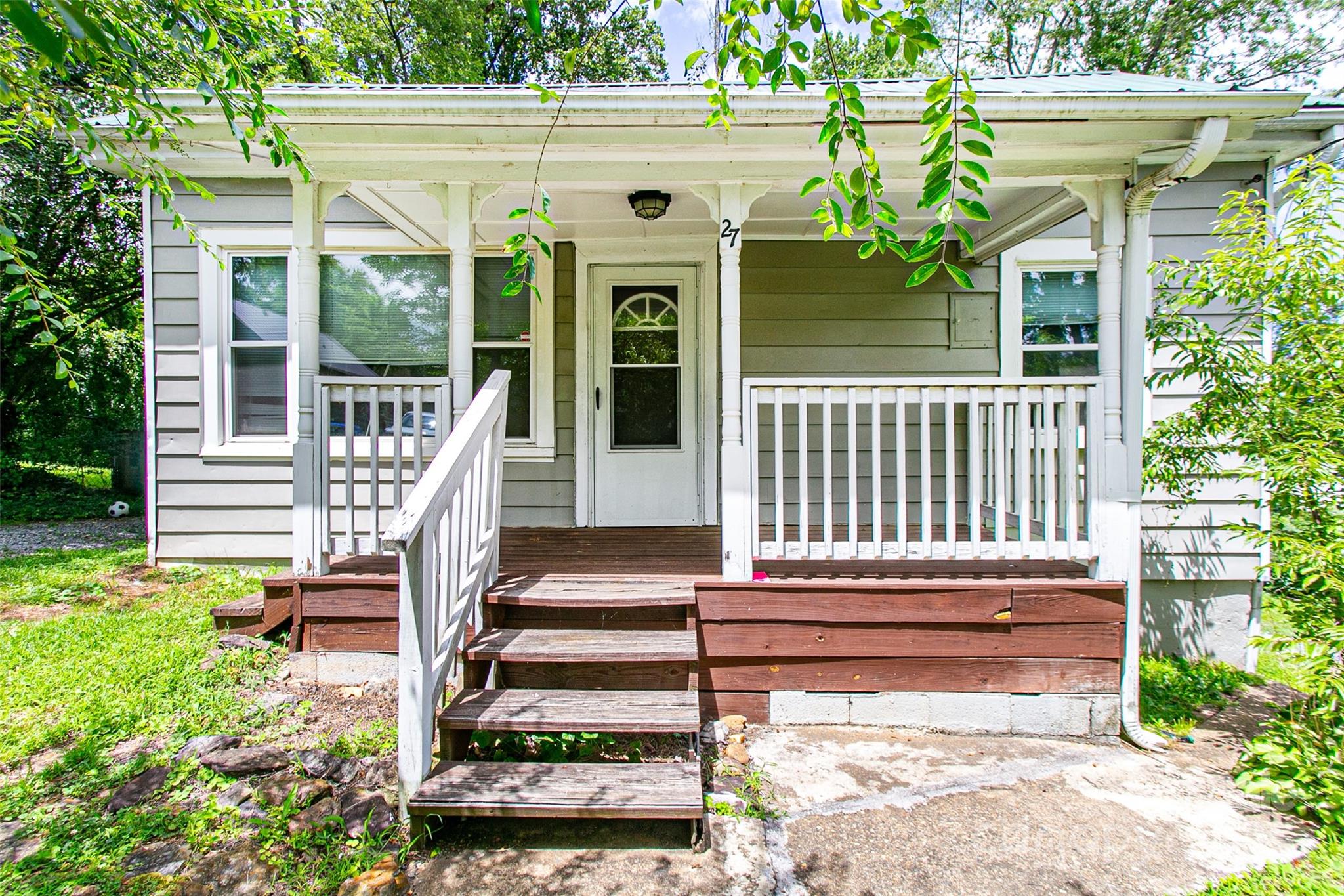 27 Curlee Street Brevard, NC 28712 - Photo 3 of 30 a front view of a house with a porch