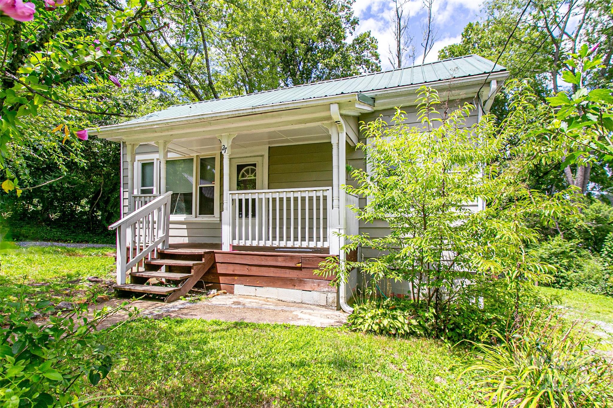 27 Curlee Street Brevard, NC 28712 - Photo 4 of 30 a view of a house with a yard and sitting area
