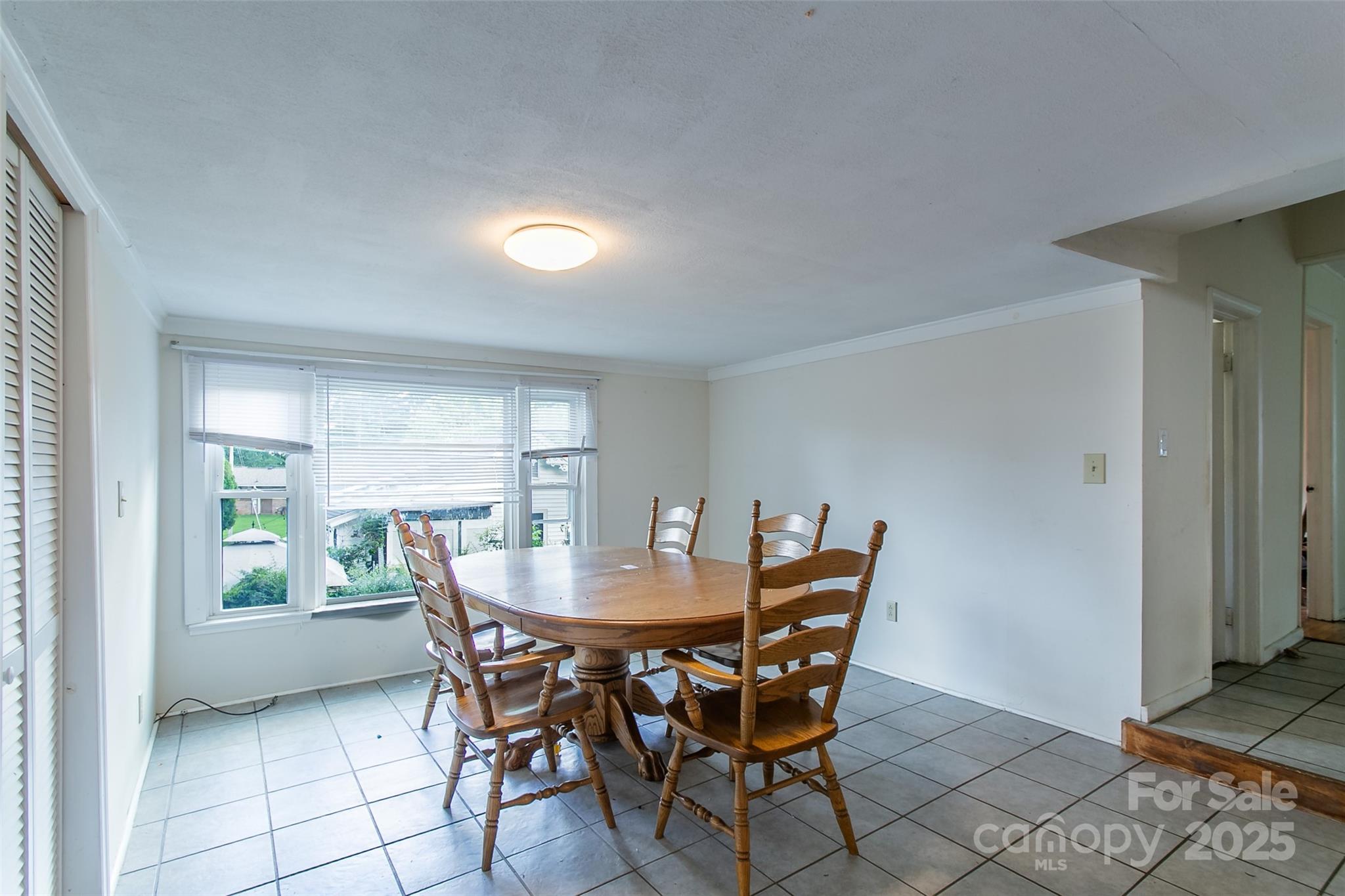 27 Curlee Street Brevard, NC 28712 - Photo 7 of 30 a dining room with furniture and window