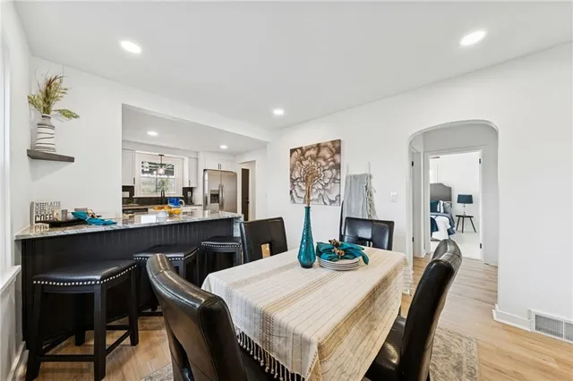 a dining room with a table and chairs