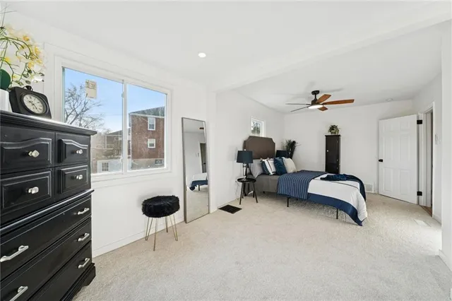 a bedroom with furniture and a window