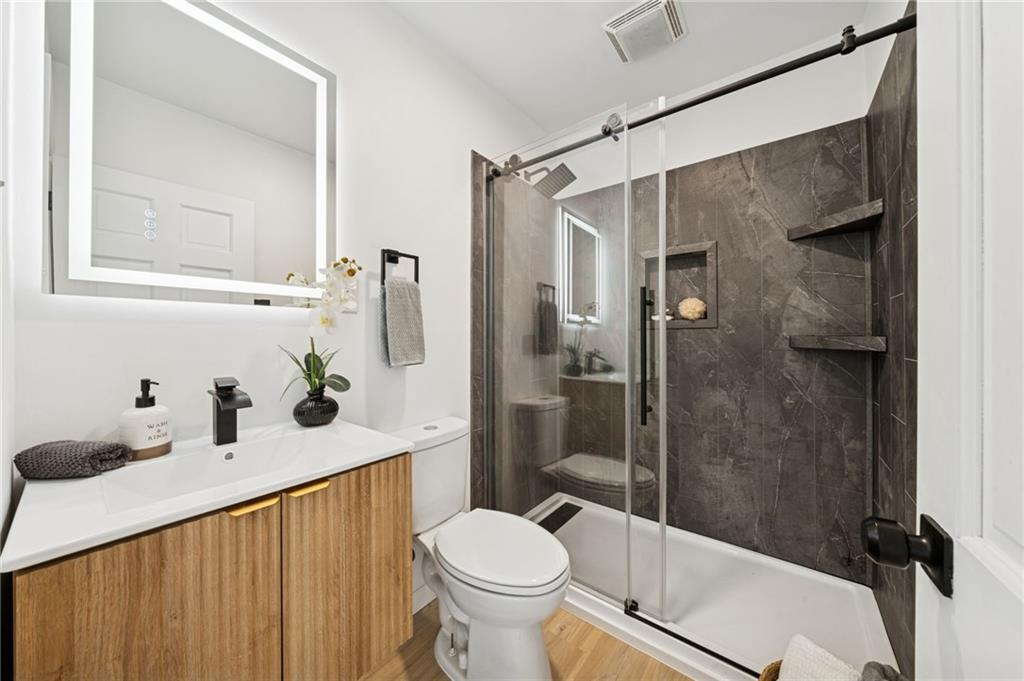 3230 Brodhead Road Aliquippa, PA 15001 - Photo 18 of 38 a bathroom with a granite countertop sink toilet and shower