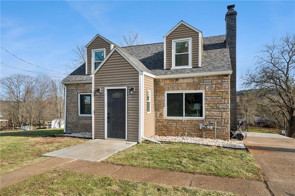 3230 Brodhead Road Aliquippa, PA 15001 - Photo 2 of 38 a front view of a house with a yard