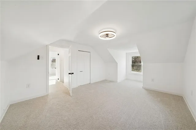 an empty room with windows and entrance