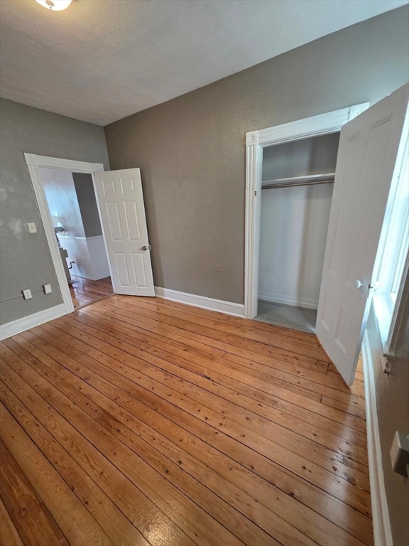 762 Globe Street, Unit 2 Fall River, MA 02724 - Photo 11 of 20 a view of empty room with wooden floor