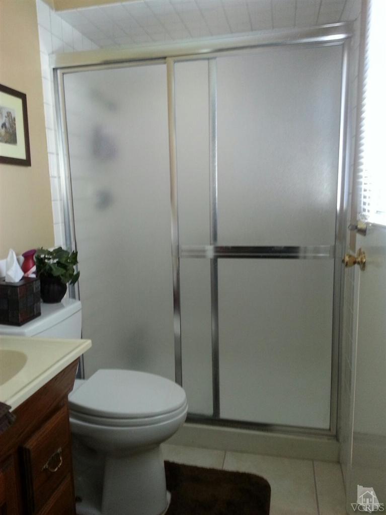 1758 Fitzgerald Road Simi Valley, CA 93065 - Photo 22 of 38 a bathroom with a sink a toilet and shower