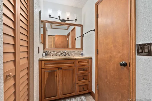 a bedroom with a bed and a flat tv screen