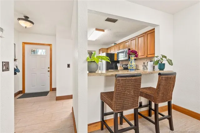 a living room with furniture and fireplace