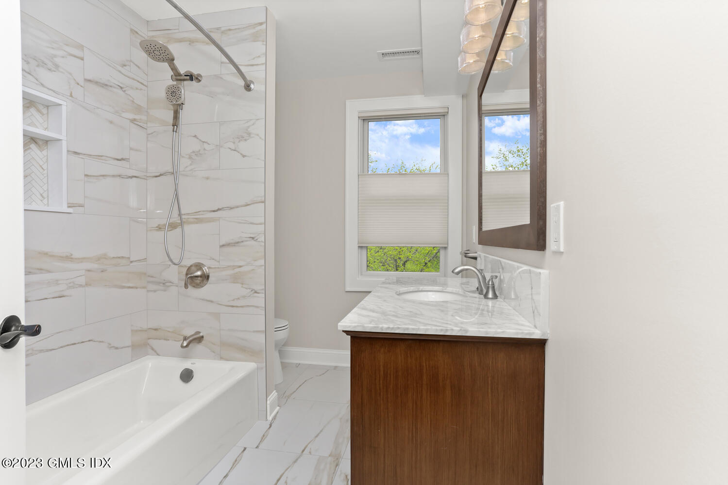 44 Riversville Road, Unit 2 Greenwich, CT 06831 - Photo 11 of 21 a bathroom with a granite countertop sink and a bathtub