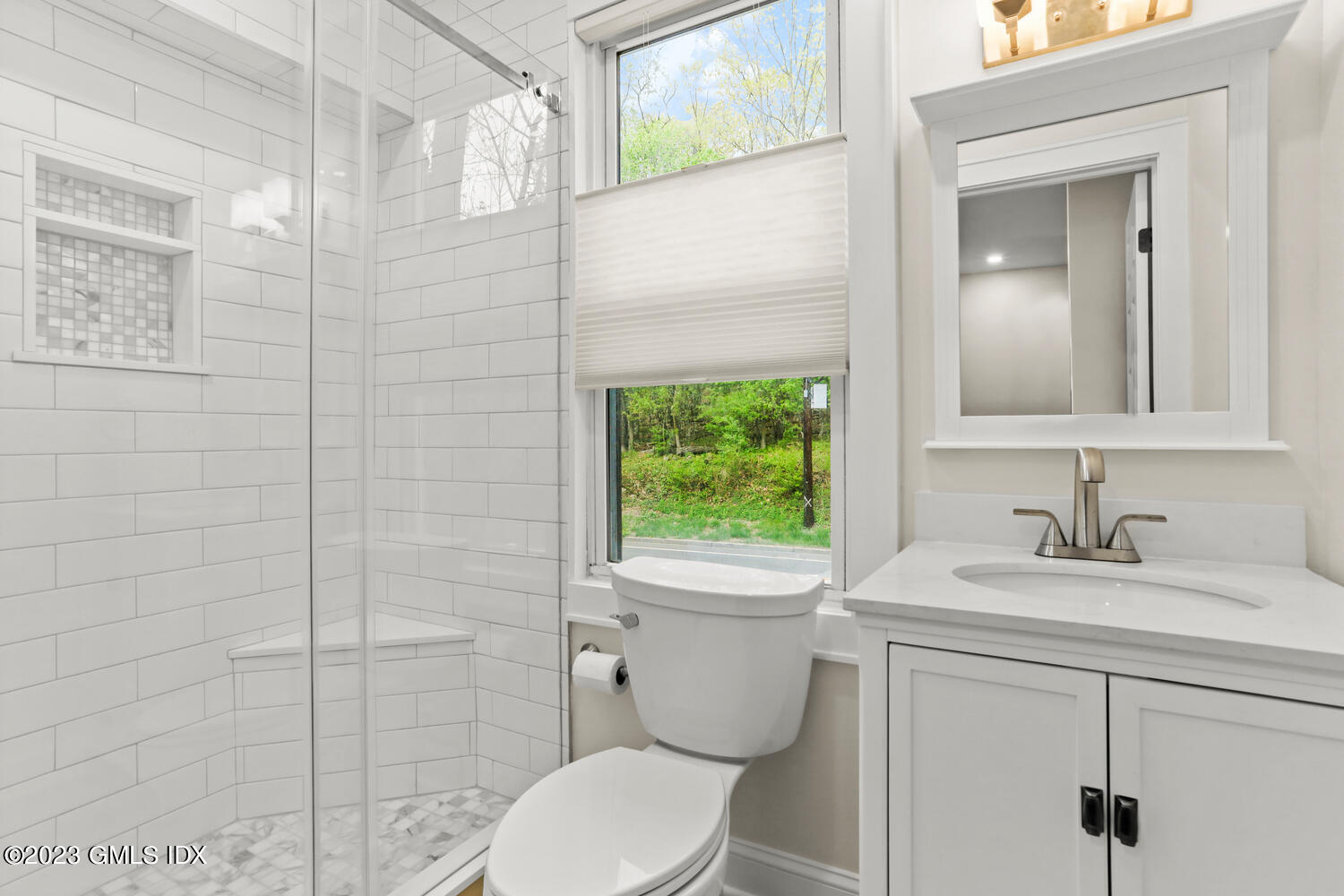 44 Riversville Road, Unit 2 Greenwich, CT 06831 - Photo 15 of 21 a bathroom with a toilet sink vanity and mirror