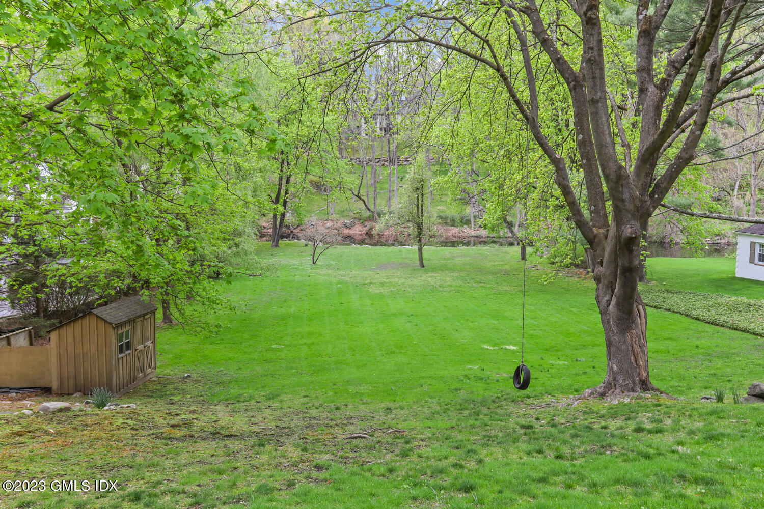 44 Riversville Road, Unit 2 Greenwich, CT 06831 - Photo 17 of 21 a view of a tree in a yard