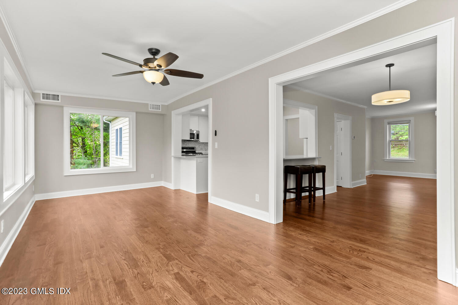 44 Riversville Road, Unit 2 Greenwich, CT 06831 - Photo 2 of 21 an empty room with wooden floor and windows