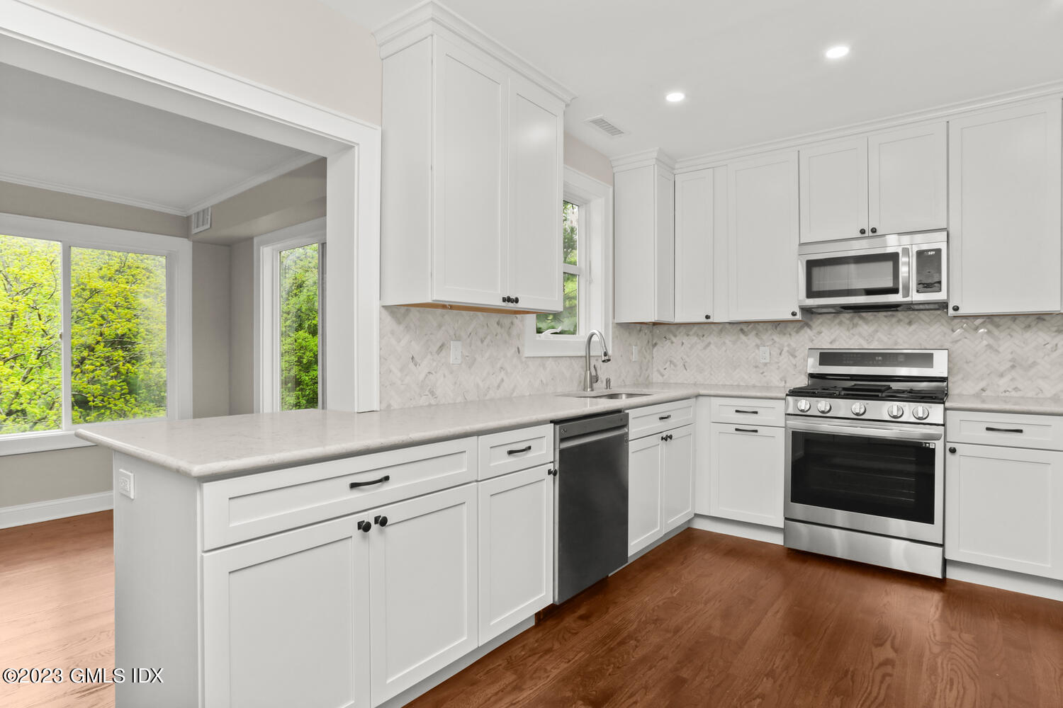 44 Riversville Road, Unit 2 Greenwich, CT 06831 - Photo 6 of 21 a kitchen with stainless steel appliances white cabinets a sink and a stove
