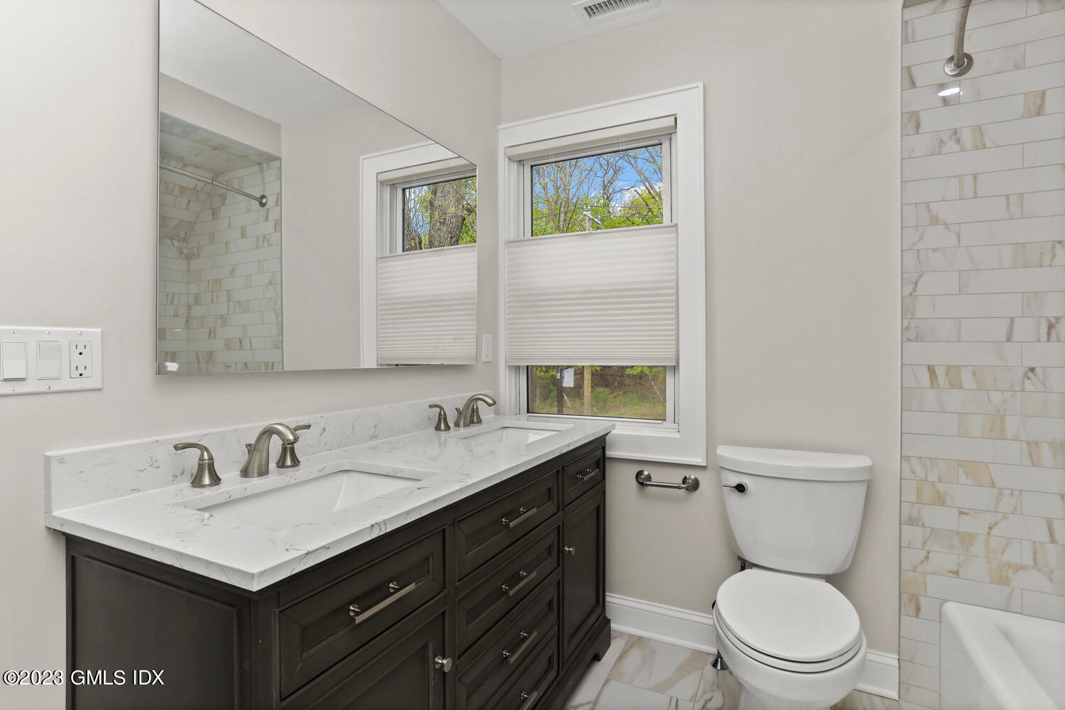 44 Riversville Road, Unit 2 Greenwich, CT 06831 - Photo 9 of 21 a bathroom with a toilet sink vanity granite and mirror