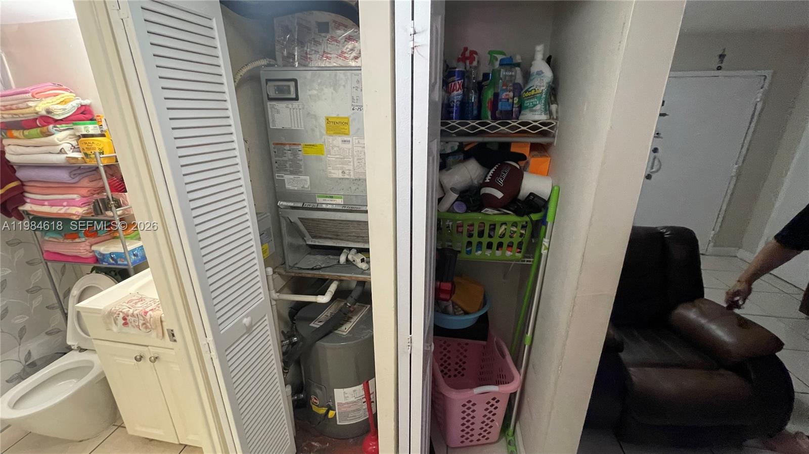 1805 West 56th Street, Unit 113 Hialeah, FL 33012 - Photo 11 of 11 a view of walk in closet with clothes and shoes