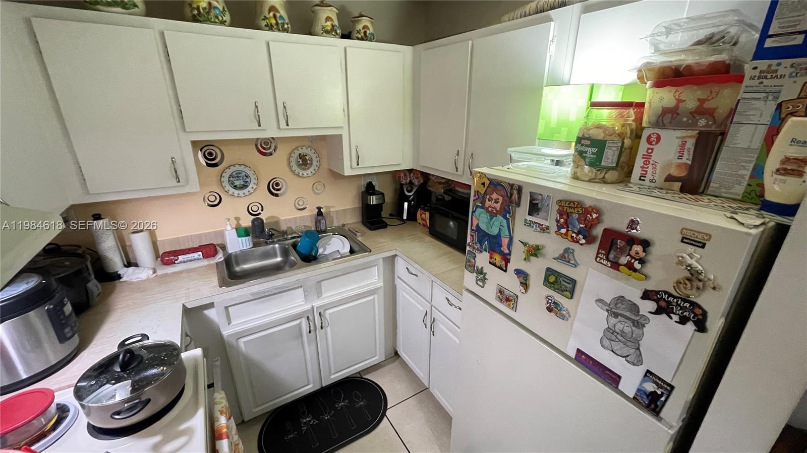 1805 West 56th Street, Unit 113 Hialeah, FL 33012 - Photo 6 of 11 a room with storage and utility